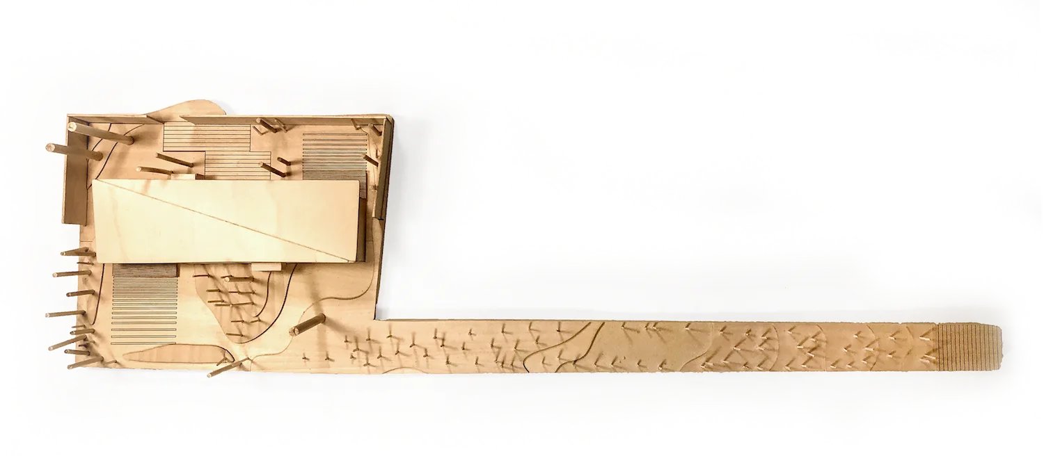Photo of an eighth-inch scale wooden site model showing the house and a long landscape strip — from Transitional Housing, a two-unit dwelling by Jack Rusk and collaborators (Yale School of Architecture, Spring 2020)